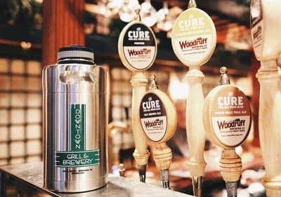 Downtown Grill & Brewery / Woodruff Brewing logo